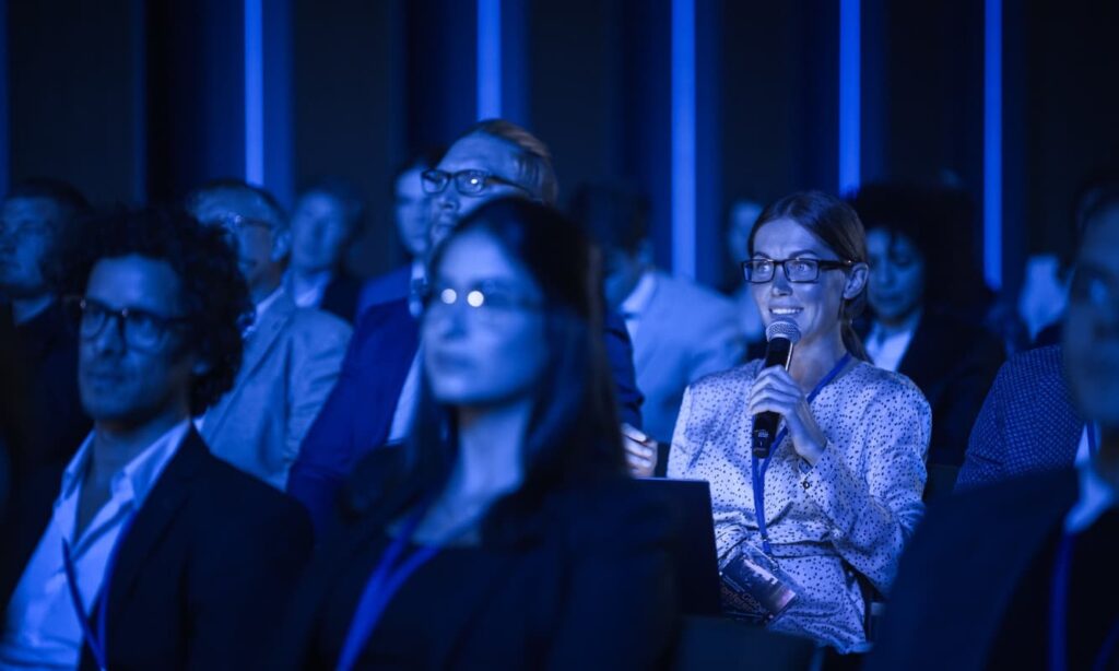 IT and security professionals listening to a keynote speech at Cisco Live 2024.