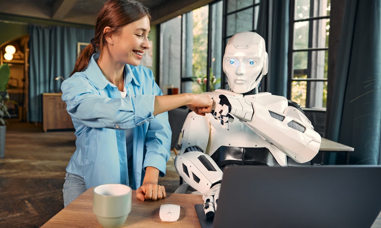 Woman and AI robot work together in office