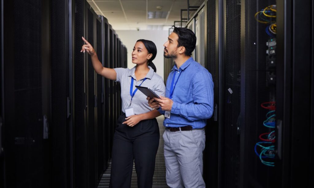 Two IT experts at a data center