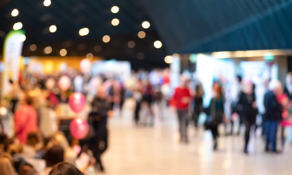 Blurred crowd of people in modern interior during event